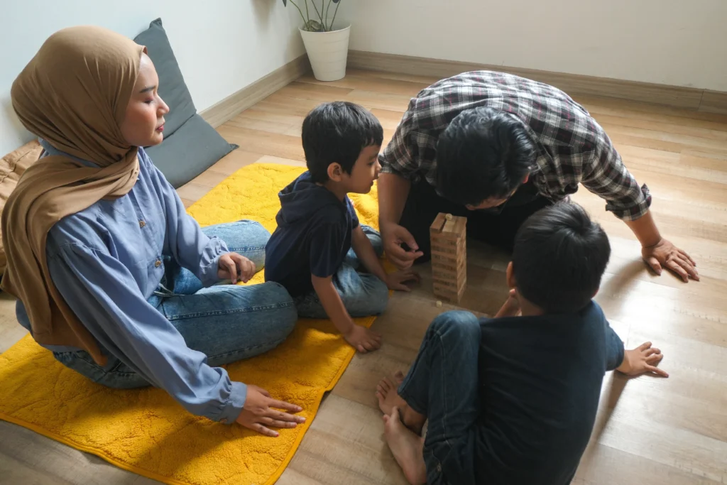 Parenting is not only about what we say to our children. It is also about how we show up when we say it. A parent can use the right words but still communicate tension through their tone, body language, pace, or emotional reactions.
This is what makes the "energetics of parenting" worth exploring. It does not mean that parents are responsible for every emotion or behavior their child experiences. Rather, it invites us to notice how our own emotional state can shape everyday interactions.
As a conscious parenting coach, Vedangi Brahmbhatt emphasizes self-awareness, emotional regulation, empathy, mindful responses, and connection as important parts of conscious parenting.
Quick Answer: Can a Parent’s Emotional State Affect a Child?
Yes, a parent’s emotional state can influence the emotional climate of everyday interactions. Children observe tone, facial expressions, reactions, and patterns of communication. A conscious parenting coach can help parents become more aware of their own triggers and respond with greater calm and intention. This does not mean parents must be calm all the time. It means learning to notice, pause, and repair when needed.
Key Takeaways for Creating a Calmer Emotional Environment
Your child is affected by the emotional atmosphere at home, but you are not responsible for controlling every feeling they have.
Self-awareness is an important part of conscious parenting because your reactions can influence how you respond to your child.
Parenting is not about maintaining perfect calm. It is about noticing your reactions and making room for more intentional responses.
Connection does not mean avoiding boundaries. Calm, respectful boundaries can coexist with empathy and understanding.
One of the most useful parenting tips is to work on your own response before trying to change your child’s behavior.
What Parents Mean When They Talk About "Energy"
The word energy can sound abstract, so it helps to make it practical.
In parenting, your energy can be understood as the emotional tone you bring into an interaction. Imagine coming home after a stressful day. Your child asks the same question three times. You may answer differently when you are rested compared with when you are overwhelmed.
The words might be identical, but your tone, facial expression, patience, and body language may not be.
This is where self-awareness becomes important. Vedangi's approach to conscious parenting places attention on understanding your own feelings and reactions rather than responding impulsively.
Your child may not know that you had a difficult meeting, skipped lunch, or have been worrying about something all day. They simply experience the interaction.
That does not mean a parent's difficult emotions automatically cause a child's difficult behavior. Children have their own personalities, needs, experiences, and emotions. The goal is not to eliminate parental stress, but to become more conscious of what happens when stress enters the parent-child relationship.
Why Parental Stress Can Change the Way We Respond
Stress can narrow our attention. A situation that might normally feel manageable can suddenly feel much bigger.
For example, a child spilling water may normally be a minor inconvenience. On an exhausting day, the same incident may trigger irritation.
The child has not necessarily changed. The parent's internal state has.
This is one reason conscious parenting tips often begin with the parent rather than the child's behavior. Vedangi's content emphasizes moving from reaction toward reflection, including recognizing emotional triggers and becoming more aware of patterns that influence parenting responses.
Notice the Trigger Before Correcting the Behavior
Instead of immediately asking, "Why is my child behaving this way?", try asking:
"What is happening inside me right now?"
You might notice:
"I feel rushed."
"I am afraid we will be late."
"I have already repeated myself several times."
"I am carrying frustration from something unrelated."
"I expected my child to cooperate immediately."
That small moment of awareness can create space between the feeling and the reaction.
Children Learn From What Parents Model
Children learn about relationships partly by observing how adults handle everyday situations. Vedangi's conscious parenting framework specifically highlights modeling behavior and leading by example as important principles.
If a parent wants a child to communicate respectfully, the parent also has opportunities to model respectful communication.
If a parent wants a child to acknowledge mistakes, the parent can demonstrate what accountability looks like.
For example, a parent might say:
"I was frustrated and I raised my voice. I am sorry. I should have spoken more calmly. Let’s try that conversation again."
This does not remove the boundary or expectation. It shows the child that making a mistake does not prevent us from taking responsibility for how we handled it.
That distinction matters. Conscious parenting is not about being endlessly permissive. It can include clear boundaries, guidance, accountability, and respectful communication.
Simple Parenting Tips for Becoming More Emotionally Aware
Becoming more aware of your emotional state does not require a complicated routine. Start with small practices that fit into ordinary family life.
1. Create a pause before responding
When you notice yourself becoming reactive, slow down. Take a breath, lower your voice, or tell your child, "I need a moment."
The purpose is not to avoid the conversation. It is to give yourself enough space to choose your response.
2. Identify your recurring triggers
Notice which situations repeatedly make you lose patience. Is it bedtime? Homework? Sibling conflict? Getting out of the house?
Once you identify a pattern, you can prepare for it instead of being surprised by it.
3. Separate the child from the behavior
Instead of thinking, "My child is being impossible," describe what is actually happening: "My child is refusing to put the toys away."
This can make it easier to address the behavior without turning it into a judgment about the child.
4. Check your expectations
Sometimes our frustration comes from expecting children to behave beyond what the situation realistically allows.
Ask yourself whether your expectation is clear, reasonable, and appropriate for your child's age and circumstances.
5. Repair after difficult moments
You will not always respond perfectly. Repair matters.
A sincere apology, a calm conversation, or simply reconnecting after conflict can help restore the relationship. Vedangi's parenting philosophy similarly emphasizes connection, reflection, and showing up rather than expecting perfection.
When "Staying Calm" Becomes Another Pressure on Parents
There is an important misunderstanding around conscious parenting: the idea that a good parent should always be peaceful.
That expectation can create another layer of guilt.
You can be a conscious parent and still become irritated. You can feel overwhelmed. You can have a difficult day.
The difference is what you do with that awareness.
Instead of thinking, "I failed because I got angry," consider asking, "What can I understand about what happened, and how can I repair it?"
Conscious parenting is better viewed as an ongoing practice of awareness and intentionality, rather than a requirement to respond perfectly every time.
An Illustrative Family Scenario: When Everyone Is Carrying Stress
Consider a parent who is trying to get their child ready for school. The child is moving slowly, asking questions, and resisting the morning routine.
The parent becomes increasingly frustrated and starts giving sharper instructions.
The child becomes upset and less cooperative.
At this point, the parent could focus entirely on making the child obey. Or the parent could pause and recognize that the morning has become emotionally charged for both of them.
The parent might lower their voice, acknowledge the child's feelings, restate the expectation, and give one simple next step.
This does not guarantee that the child will immediately cooperate. The value lies in changing the interaction from escalating reactions toward clearer, calmer communication.
The lesson is not "change your energy and your child will behave." The more realistic lesson is that changing your own response can change the quality of the interaction.
What I have Observed as a Parenting Coach
I often encourage parents to look inward before immediately looking at their child's behavior.
In my coaching conversations, I believe one useful question is: "What is this moment bringing up for me?"
Sometimes a child's behavior is genuinely challenging. But sometimes the intensity of our response tells us something about our own stress, expectations, fears, or past experiences.
I also encourage parents not to turn self-awareness into self-blame. The purpose of noticing your emotions is not to criticize yourself. It is to understand yourself well enough to make a different choice when you can.
For me, this is one of the foundations of conscious parenting: connection begins with awareness. When parents become more intentional about how they communicate, listen, set boundaries, and respond, they create more opportunities for respectful family interactions.
Vedangi's approach also places self-management, emotional regulation, empathy, modeling behavior, and connection over control at the center of parenting.
The Most Useful Shift: From "How Do I Change My Child?" to "How Do I Show Up?"
One of the simplest ways to think about the energetics of parenting is this:
You cannot control your child's every emotion, but you can become more conscious of your own presence in the relationship.
That means noticing your triggers, communicating clearly, maintaining appropriate boundaries, taking responsibility for mistakes, and making room for repair.
These are not quick fixes. They are everyday parenting practices that can gradually shape the emotional tone of family life.
Parenting Starts With the Way We Show Up
The energetics of parenting is ultimately less about having the "right" energy and more about becoming aware of the emotional presence we bring into everyday family moments.
You do not need to be calm every minute. You do not need to eliminate frustration. You do not need to become a perfect parent.
Instead, begin by noticing yourself.
If you’d like more personalised guidance, Vedangi Brahmbhatt’s Conscious Parenting Course offers practical strategies for creating routines that support calmer, more connected family life.
Frequently Asked Questions
Q1. How does a parent’s emotional state affect a child’s behavior?
A. A parent's emotional state can influence the tone and quality of parent-child interactions. Stress may make communication more reactive or impatient, while greater self-awareness can create space for calmer responses. However, children have their own emotions and experiences, so parental stress should not be treated as the sole explanation for a child's behavior.
Q2. What is the connection between parental stress and children’s emotions?
A. Parental stress can affect how a parent communicates, responds to conflict, and interprets a child's behavior. This can influence the emotional atmosphere at home. The goal is not to remove all stress, but to recognize when stress is affecting your responses and create opportunities to pause and reconnect.
Q3. How can parents become more aware of their emotional triggers?
A. Start by noticing patterns. Keep track of situations that repeatedly lead to frustration, such as bedtime, homework, sibling disagreements, or rushed mornings. Ask what you are feeling, what you expected, and what you need in that moment. This kind of reflection is consistent with conscious parenting's emphasis on self-awareness.
Q4. Can children sense a parent’s mood and energy?
A. Children can notice aspects of a parent's emotional state through things such as tone of voice, facial expression, body language, and changes in interaction. This does not mean children can always understand why a parent feels a certain way. Clear communication helps children make sense of what they experience.
Q5. What practices can help parents create a calmer emotional environment at home?
A. Simple practices can include pausing before reacting, naming your feelings, using respectful boundaries, listening before correcting, creating predictable family routines, and repairing after conflict. Vedangi's conscious parenting approach also emphasizes mindfulness, empathy, communication, and positive role modeling.
